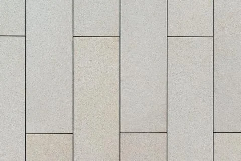 Wall of rectangular slabs of light limestone Stock Photos