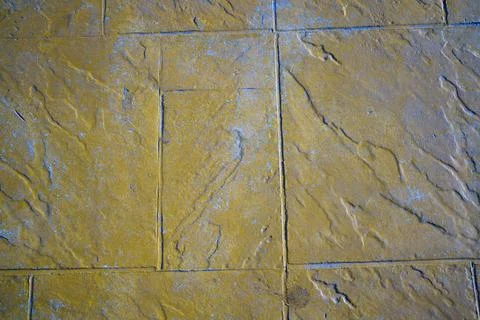 Wall of rectangular stone bricks. background and texture of cobblestones. Stock Photos