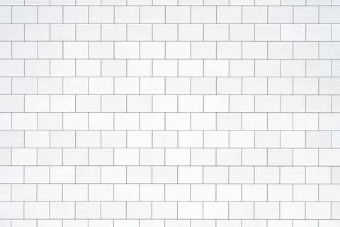 Wall with rectangular white stone slabs Stock Photos