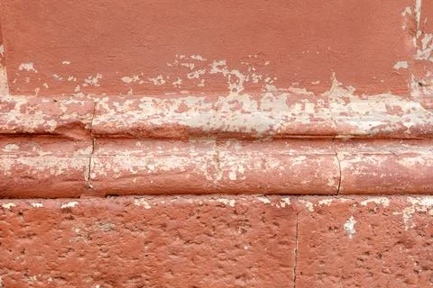 A wall with a red brick border Foto stock