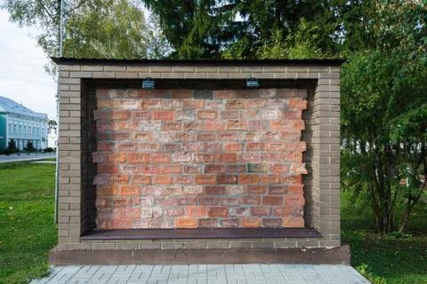 A wall of red bricks from different manufacturers in Tsarist Russia, the vill Stock Photos