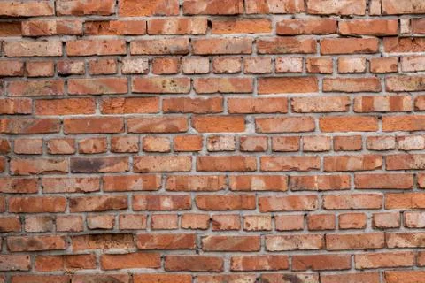 Wall of red bricks. Texture or background of bricks. Stock Photos