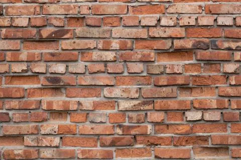 Wall of red bricks. Texture or background of bricks. Stock Photos