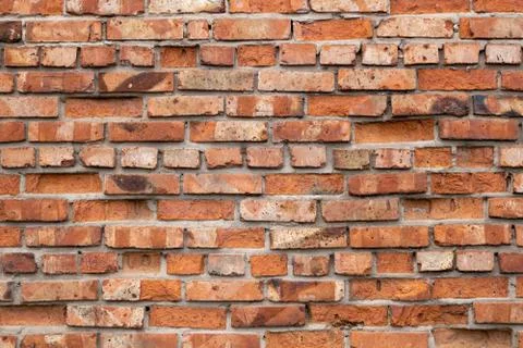 Wall of red bricks. Texture or background of bricks. Stock Photos
