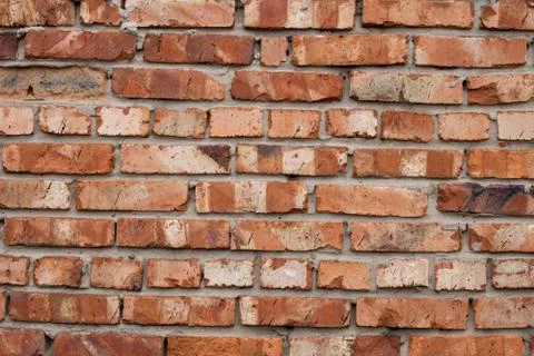 Wall of red bricks. Texture or background of bricks. Stock Photos