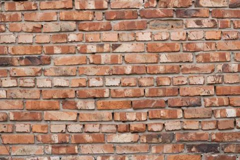 Wall of red bricks. Texture or background of bricks. Stock Photos