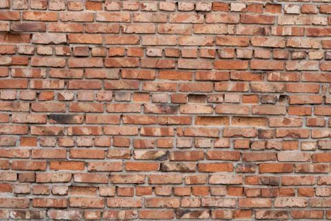 Wall of red bricks. Texture or background of bricks. Stock Photos
