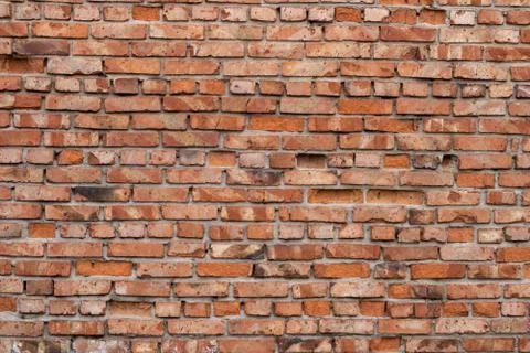 Wall of red bricks. Texture or background of bricks. Stock Photos