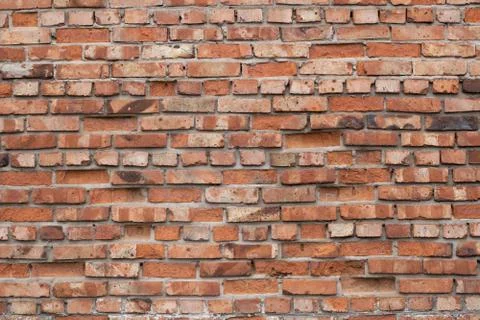 Wall of red bricks. Texture or background of bricks. Stock Photos