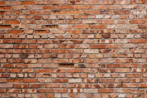 Wall of red bricks. Texture or background of bricks. Stock Photos