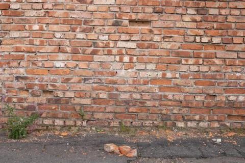 Wall of red bricks. Texture or background of bricks. Stock Photos
