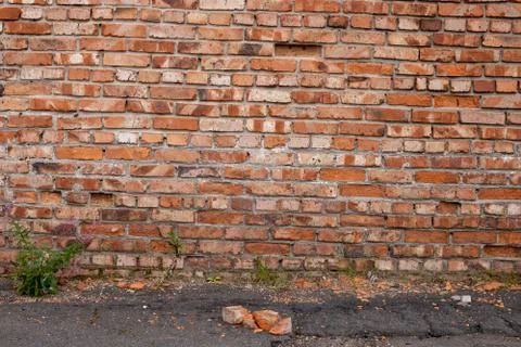 Wall of red bricks. Texture or background of bricks. Stock Photos