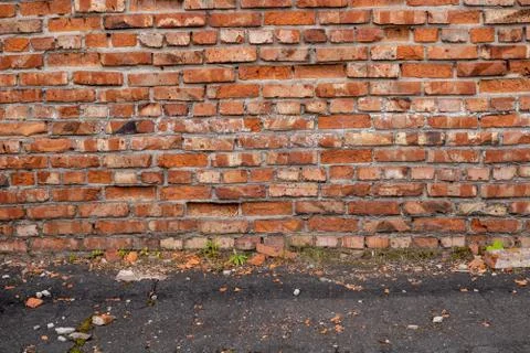 Wall of red bricks. Texture or background of bricks. Stock Photos