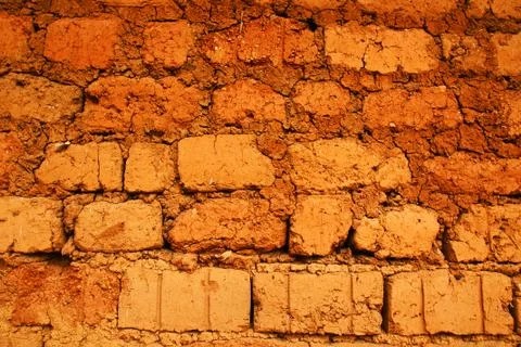 Wall of red earth bricks Stock Photos