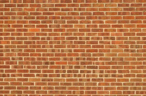 Wall with red / orange bricks. Abstract background Stock Photos