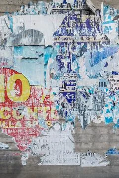 Wall with ripped posters Stock Photos