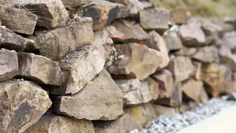 A wall of rough stone Stock Footage 115564801