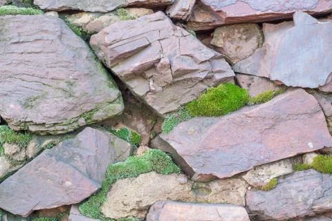 Wall from a rough stone Stock Photos