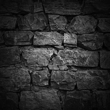Wall of rough stones in the background. light effect wall of rough stones ... Foto stock