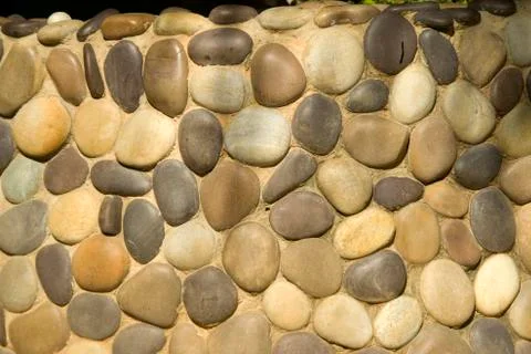 Wall of Round Pebbles Stock Photos