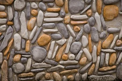 Wall round stone rock texture and seamless background Stock Photos