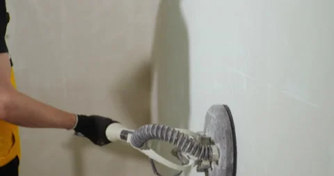 Wall Sander close up. Sanding Walls for painting using Wall Sander. DIY home 库存影片 150724204
