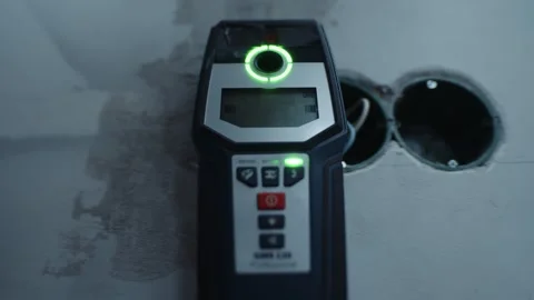 Wall scanner detecting wiring during electrical work Stockbeeldmateriaal 312227053