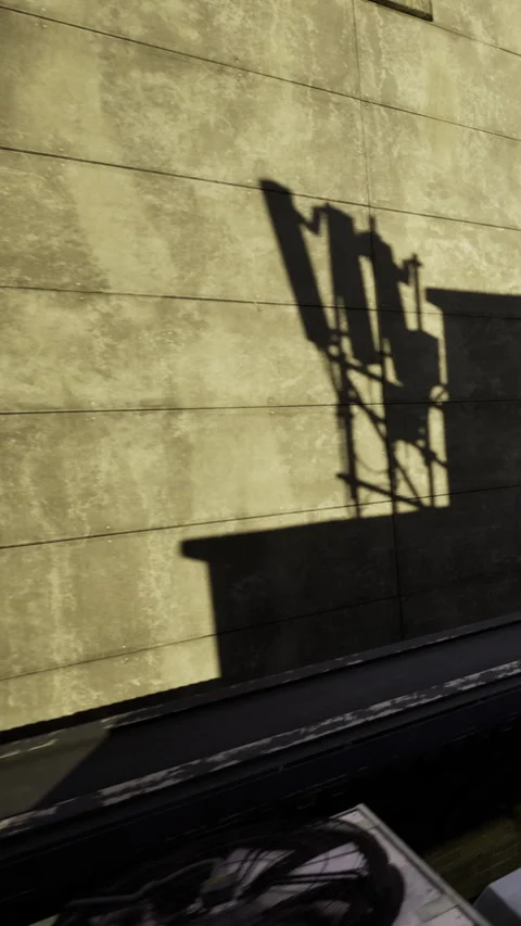 Wall with shadow cast by a structure during afternoon light Stock Footage 342454486