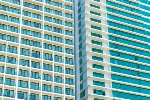 Wall of skyscraper with balconies and windows Stock Photos