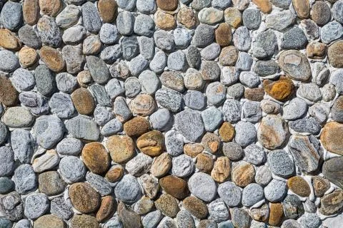 Wall of small pebbels Stock Photos