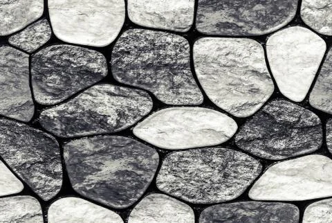 Wall of small stone texture background. endless seamless background fill Stock Photos