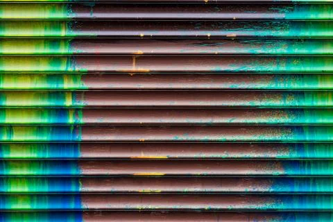 Wall with smudges of multi-colored paint. Stock Photos