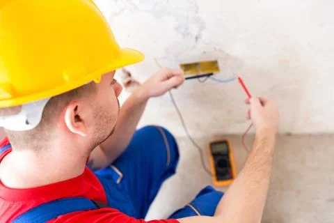 Wall socket current checking with unimer Stock Photos