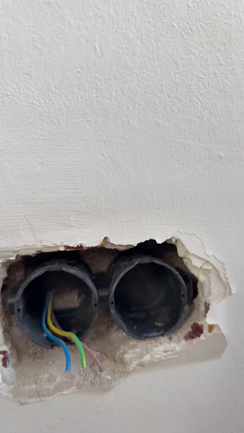 Wall socket hole.Exposed electrical wires. Stock Footage 340427725
