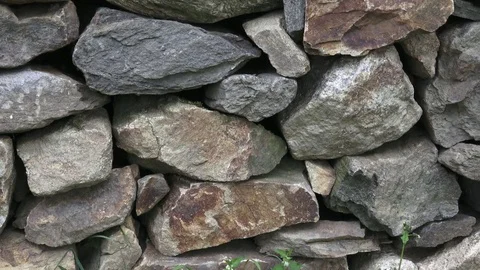 Wall of stacked slabs of stone. Dry wall... | Stock Video | Pond5