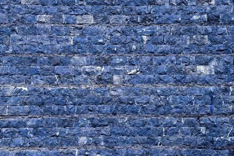 Wall of stone in blue tint Stock Photos