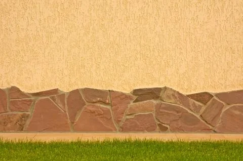 A wall with a stone border Stock Photos