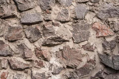Wall of stone closeup as background Stock Photos
