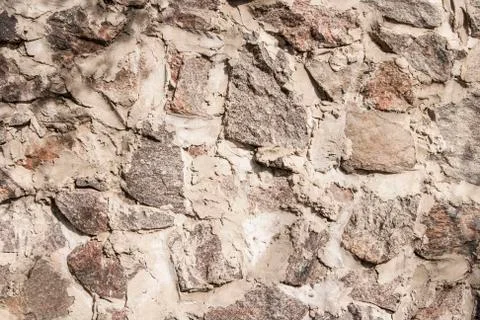 Wall of stone closeup as background Stock Photos