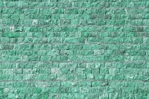 Wall of stone in green tint 写真素材