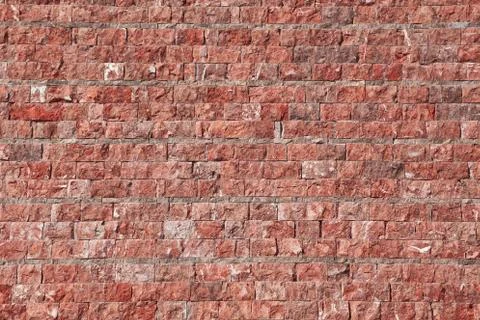 Wall of stone in red tint Stock Photos