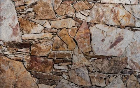 Wall of stone as texture and background Stock Photos