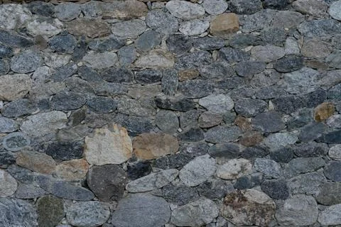 Wall of stone as texture and background Stock Photos