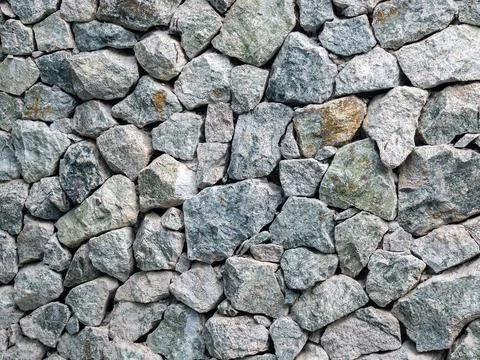 Wall stone texture background. Granite wall. Stock Photos