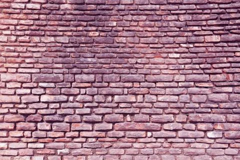 Wall of stone in violet tint 写真素材