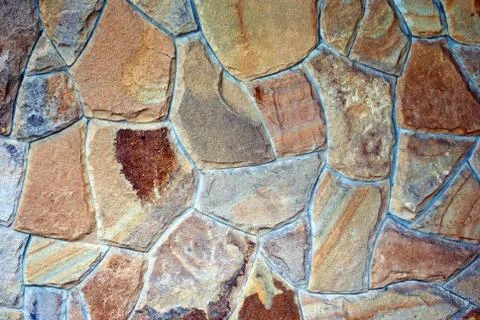 Wall of stones stone wall texture of gray color on a summer day Stock Photos