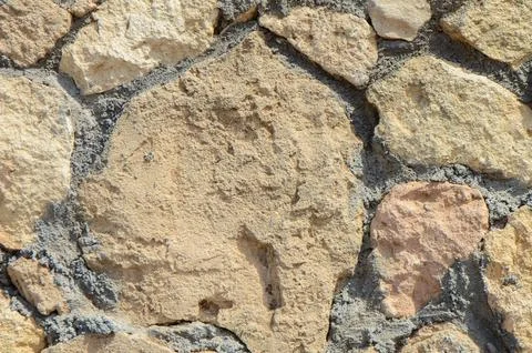 Wall of stones as a texture Stock Photos