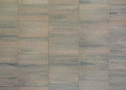 The wall structure is made of stone blocks under granite. Natural stone texture. Stock Photos