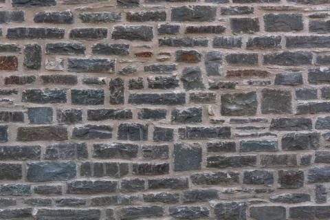 Wall structure of an old stone wall Stock Photos