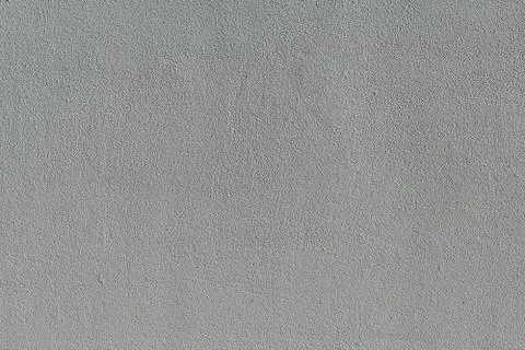 The wall surface is lined with plaster and painted with gray paint. Stock Photos